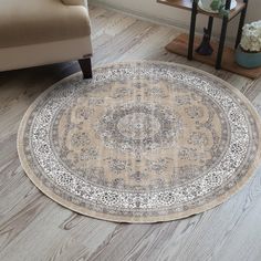 a round rug on the floor in a living room