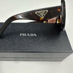 Prada Tortoise Large Cat Eye Frame Sunglasses - Worn Only Once, Perfect Condition- No Scratches And Original Box, Case For Handbag Or Luggage And Included Wrapped Wiping Cloth And Paperwork With Authenticity Markings Designer Tortoiseshell Sunglasses For Formal Occasions, Designer Brown Sunglasses With Uva Protection, Luxury Tortoiseshell Sunglasses With Uva Protection, Prada Sunglasses Vintage, Luxury Brown Sunglasses With Uva Protection, Designer Brown Cat Eye Sunglasses, Sunglasses Prada Women, Prada Square Sunglasses, Prada Sunglasses Tortoiseshell