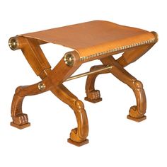 a small wooden bench with metal fittings on it's legs and footrests