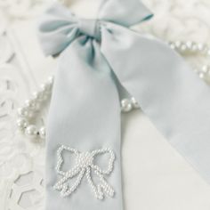 Beautiful dusty blue bow with delicate pearl hand beading. Finish: Alligator Clip* 8 inches long* Material: Cotton Elegant Blue Ribbon Bow, Elegant Blue Bow As Gift, Elegant Blue Bow For Wedding, Trendy Headbands, Cute Hair Accessories, Brunch Dress, School Dresses, Cute Hair, Half Sleeve Dresses