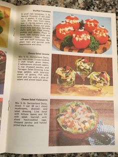 an open recipe book with pictures of vegetables and salads in it on a table