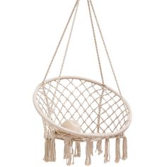 a white hanging chair with tassels