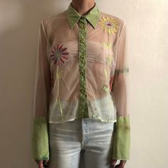 Cool 1990s Romeo Gigli sheer nylon mesh blouse with embroidered flowers. Great 90s pop style - looks like something to be worn in a Dee Lite video. Irregularily dyed nylon mesh in a light green and white. Super sheer. Bright shiny embroidered flowers decorate the front and the back. The buttons! are square shaped yellow jewels. Four buttons on each wide sleeve cuff. Label Gigli, made in Italy, size XL. 100% nylon. Please wash by hand cool, drip dry. Very good vintage condition with no fabric or Sheer Button Up Blouse Outfit, Mesh Button Up, Romeo Gigli, Sheer Mesh Top, Mesh Blouse, Mesh Shirt, Pop Style, Green Tie, Sleeve Cuff