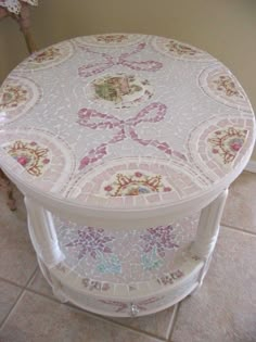 a white table sitting on top of a tiled floor