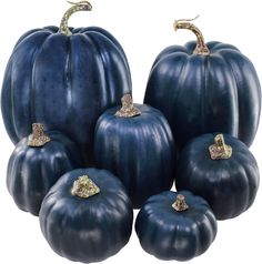 five blue pumpkins with gold decorations on them