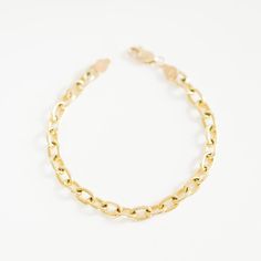 14K Yellow Gold Elongated Chain Bracelet This beautiful oversized solid gold Elongated Chain Bracelet is a hefty piece and makes enough of a statement to wear on its own. Order by itself or with charms that represent your special milestones and loved ones. Pair with any of our loose charms and we will assemble them in-house for you! We recommend medium sized charms. Product Details Link Size: 5x7 mm Weight: 7.5 inches (Solid Gold) is 13 grams Not sure what size to order? Check out our Bracelet S Gold Oval Link Figaro Chain Bracelet, Gold Figaro Chain Bracelet With Oval Links, Heirloom Yellow Gold Oval Link Bracelets, Heirloom Yellow Gold Oval Link Bracelet, 14k Gold Rolo Chain Bracelet, Elegant Gold Charm Bracelet With Figaro Chain, Formal Gold Chain Charm Bracelet With Oval Links, Gold Oval Link Charm Bracelet, Tarnish Resistant, Gold Tarnish Resistant Oval Link Charm Bracelet