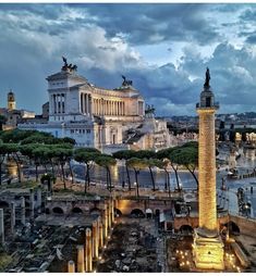 an aerial view of the roman forum in rome, italy at dusk with clouds overhead