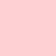 a pink background with an airplane flying in the sky