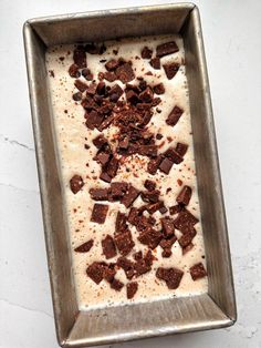 a metal pan filled with ice cream and chocolate chunks