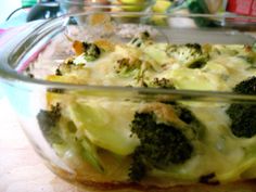 broccoli and cheese casserole in a glass dish on a counter top