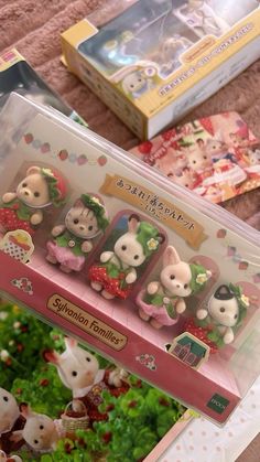 some little animal figurines are in a box