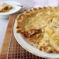 a pie sitting on top of a white plate