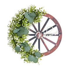 a wooden wheel with flowers and leaves around it