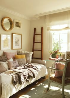 a living room filled with lots of furniture next to a table and window sill