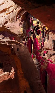 the interior of a cave is painted in pink and yellow