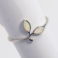 All Sterling Silver items in our shop are stamped 925, lead and nickel free, solid 925 silver, NOT plated or filled. Opal Floral design 925 Sterling Silver Band Lab grown Fire White Opal Band Dainty Stackable Minimalist Simple Thumb ring October Birthstone Simple Silver Band great for every day made with finest quality sterling silver 925.  Opal is the October Birthstone. Wearing Opal is considered by many to brings loyalty, faithfulness and spontaneity in the wearer.  Low profile, very smooth, Sterling Silver Open Band Jewelry Gift, Sterling Silver Open Band Jewelry For Gifts, Nickel Free Sterling Silver Open Band Jewelry, Nickel-free Sterling Silver Open Band Jewelry, Minimalist Adjustable Opal Ring For Anniversary, Nickel Free White Gold Open Band Jewelry, Nickel-free Open Band White Gold Jewelry, Nickel-free White Gold Open Band Jewelry, Minimalist Sterling Silver Opal Ring