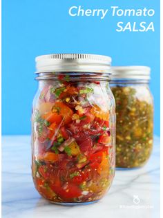 two glass jars filled with different types of food