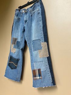 an old pair of jeans with patches on them