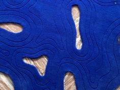 a blue piece of felt sitting on top of a wooden table