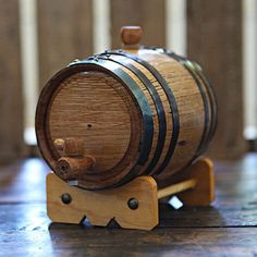 a wooden barrel sitting on top of a table