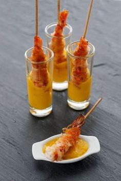 three small glasses filled with food on top of a table