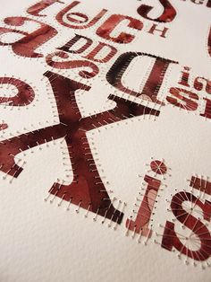 a close up view of some type of typogramic art work on paper