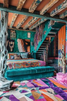 a bed sitting under a wooden staircase next to a colorful rug on top of a floor