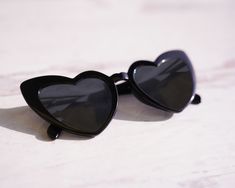 Add an elegant touch to your celebration with heart-shaped lenses of Set of 6 Heart Sunglasses. These charming accessories will protect from sun while adding a whimsical atmosphere to your special day, making it a memorable experience for your guests. Feature These heart sunglasses come in various colors like black, white, rose gold, and tortoise. Each pair is engraved with "Bride" and "Babe" on the temples, making it a unique and memorable gift for the bride and her bridesmaids. Heart sunglasse Custom Ring Box, Bachelorette Party Favor, Brides Babes, Bride And Bridesmaids, Gift For The Bride, Heart Sunglasses, Wedding Ring Box, Bachelorette Party Favors, Wedding Boxes