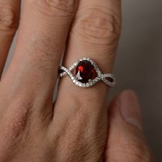 This is a gorgeous handmade creation. Its beauty is its simplicity & Elegance. The 6*8mm oval cut natural garnet crafted in sterling silver with rhodium plated. All item is sent in a beautiful gift box You can realize more lovely stuff clicking the link https://www.etsy.com/shop/knightjewelry?refshopsection_shophome_leftnav Please leave the correct address and you phone number for delivering successfully. Garnet Gemstone Jewelry For Proposal, Sterling Silver Ruby Ring For Proposal, Oval Garnet Jewelry With Halo Setting, Silver Garnet Ring For Valentine's Day, Oval Garnet Ring With Halo Setting, Polished Lab-created Ruby Ring, Oval Garnet Birthstone Ring As Gift, Oval Garnet Birthstone Ring For Anniversary, Oval Garnet Birthstone Ring