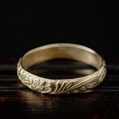 Such a lovely, vintage inspired leaves and flowers band. This ring is so easy to wear either as a standalone piece or stacked with more rings. Made by hand in our jewellery studio in Greece using traditional silversmithing techniques and tools. Please allow for slight variations between your ring and the one pictured. DETAILS -14K solid gold -Ring's band measures 4 mm wide -Polished .585 (14K) is hand stamped in the inner part of the ring -Available in US sizes 3-9 -Made to order within 7-10 bus Vintage Yellow Gold Flower Ring For Wedding, Vintage Yellow Gold Flower Wedding Ring, Vintage 14k Gold Engraved Ring For Marriage, Vintage Yellow Gold Wedding Bands, Vintage 14k Gold Engraved Marriage Ring, Vintage Flower Ring With Intricate Design For Promise, Gold Vintage Style Flower Promise Ring, Vintage Style Gold Flower Promise Ring, Vintage Flower Ring For Anniversary