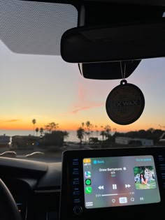 the dashboard of a car with an electronic device attached to it's dash board