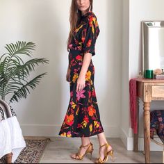 Cut From A Bold Floral Silk, Rixo’s Midi Length Dress Features A Slim Silhouette, Accented With Architectural Dolman Sleeves And A Gathered Waistline Button-Fastening At Back Of Neck Zip-Fasteing Along Side 100% Silk Very Good Condition Does Not Show Signs Of Wear Except For Small White Stain At Front Above Waist See Photo Size S Approx Measurements Taken Flat Waist 14.25” Length 51.5” Rixo Black Dress, White Stain, Sleeve Midi Dress, Photo Size, Long Sleeve Midi, Midi Length Dress, Long Sleeve Midi Dress, Dolman Sleeve, Midi Length