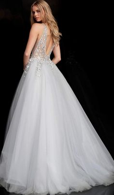 Look like a royalty when you wear this gown by Jovani 65379. Presents in a sleeveless, plunging V-neckline with sheer fitted bodice adorned with crystal embellishments. The back shows a low V-cut and is designed with an invisible back zipper. The skirt opens in a ballgown silhouette and completes the look in a train finish. This Jovani creation is truly a definition of glamour. Model is wearing Grey color. Style: jovani_65379 Details: Sleeveless, Plunging neckline, Crystal embellishments, Mesh i Ballgown Prom Dress, Prom Ballgown, Lace Prom Gown, Tulle Ballgown, Glamorous Gowns, Prom Dresses Jovani, Sleek Dress, 2020 Prom Dresses, Prom 2020