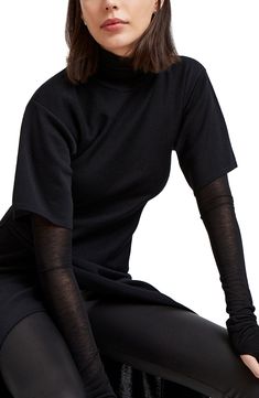 This ultrachic tunic is crafted from fine merino wool and makes a striking silhouette whether worn solo or as part of your modern layered look. Slips on over head Jewel neck Short sleeves High-low hem 100% merino wool Imported Oversized Chic Cashmere Top, Chic Oversized Cashmere Top, Elegant Cashmere Knit Top For Layering, Oversized Fine Knit Turtleneck Top, Fitted Cashmere Top For Layering, Oversized Wool Tops For Layering, Black Stretch Cashmere Top, Chic Oversized Fine Knit Top, Chic Viscose Knit Top For Layering