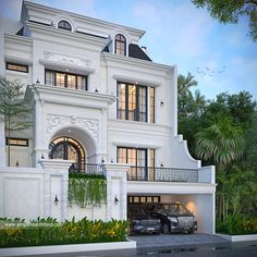 a car is parked in front of a large white building with two story windows and balconies