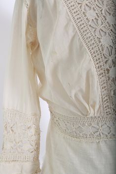 "Stunning Antique vintage early 1900's Edwardian crochet blouse Floral embroidered crochet lace, high neck long sleeve Natural cotton in ivory / cream button down back Great vintage condition - few age spots (see photos) very wearable M e a s u r e m e n t s: Size: fits like a XS S BUST: 18 1/2\" Waist: 13\" Total Length: 22\" Sleeves: 20\" Label: unbranded Fabric: cotton +All Measurements are taking while garment is lying flat+ + Jewelry, belts, and any other accessories are NOT included unless Lace Top With Crochet Trim For Daywear, Cream Lace Blouse With Crochet Trim, Fitted Bohemian Lace Top For Daywear, Cream Cotton Lace Top With Lace Trim, Vintage Long Sleeve Lace Top, Fitted Cream Blouse With Crochet Lace, Fitted Cream Lace Top With Crochet Trim, Lace Top For Daywear, Vintage Long Sleeve Lace Top With Trim