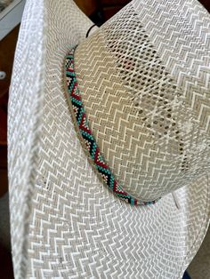 "1/4\" wide All bead work is beaded with 10lb extreme braided nylon line. All hat bands are finished at 23\" with glued than sewed down leather ends and an adjustable leather tie." Braided Western Hat Bands For Rodeo, Western Braided Hat Band For Ranch, Western Braided Hat Bands For Rodeo, Southwestern Turquoise Hat Bands For Country Events, Adjustable Southwestern Turquoise Hat Bands, Adjustable Turquoise Hat Bands For Country Events, Southwestern Turquoise Hat Band For Ranch, Traditional Beaded Hat Bands For Rodeo, Traditional Adjustable Handwoven Hat Bands