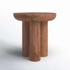 a small wooden table sitting on top of a white floor