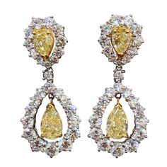 A beautiful earring featuring approximately 6 carats of yellow diamond pear shapes and 9 carats of white round brilliant diamonds set in 18k gold. 1st Dibs Jewelry, Yellow Diamond Earrings, Yellow Diamond Jewelry, Yellow Diamond Earring, Pearl Chandelier Earrings, 1st Dibs, Round Diamond Earrings, Vintage Drop Earrings, Diamond Cluster Earrings