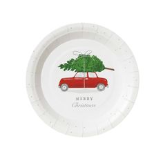 a white paper plate with a red car and a christmas tree on the top that says merry