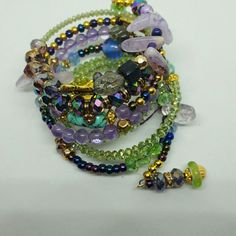 Glittery And Gorgeous This Wire Wrap Bracelet Has It All: Lavender Fluorite Beads, Peridot Czech Crystal, Turquoise Nugget, Brass And Gold, Ab Purple Faceted Crystals, Rhinestone Rondelles. Wire Wrapped Bracelet, Lavender Blue, Czech Crystal, Memory Wire Bracelets, Memory Wire, Wire Bracelet, Faceted Crystal, Green And Purple, Womens Jewelry Bracelets