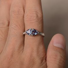 This is a gorgeous handmade creation. Its beauty is its simplicity & Elegance. The 6*6mm trillion lab alexandrite is crafted in solid sterling silver and with rhodium plated. It's made to order and it will take about 7 days to make it. All item is sent in a beautiful gift box You can realize more lovely stuff clicking the link https://www.etsy.com/shop/knightjewelry?refshopsection_shophome_leftnav Please leave the correct address and you phone number for delivering successfully. Silver Trillion Cut Sapphire Promise Ring, Silver Sapphire Trillion Cut Promise Ring, Tanzanite Birthstone Ring With Accent Stones For Promise, Tanzanite Birthstone Promise Ring With Accent Stones, Trillion Cut Sapphire Ring For Anniversary, Trillion Cut Sapphire Anniversary Ring, Trillion Cut Sapphire Gemstone Ring For Anniversary, Anniversary Trillion Cut Topaz Ring With Accent Stones, Trillion Cut Birthstone Ring For Anniversary