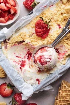 an ice cream sundae with strawberries on top