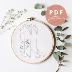 an embroidery pattern with boots and flowers on the hoop next to it is text that reads, pdf pattern