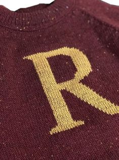 a sweater with the letter r on it