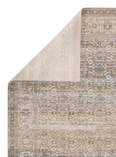 an area rug with two different colors and patterns on the bottom, one in beige