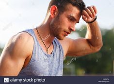 Download this stock image: Tired wet athletic man in sports blue t-shirt wiping sweat his hand on nature background - H63WTK from Alamy's library of millions of high resolution stock photos, illustrations and vectors. How To Reduce Sweating, Benefits Of Sweating, Sweating Too Much, Adrenal Fatigue Symptoms, Stop Sweating, Body Toxins, Spark People, Excessive Sweating, Adrenal Fatigue