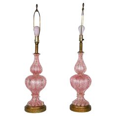 pair of pink glass lamps on brass bases