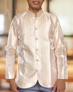 Experience the ultimate in comfort and style with our exquisite Gazar fabric coat barong, expertly crafted with layers of luxurious fabric to provide a thick and high-quality finish.  Details: Fabric: Metallic Gazar with lining and shoulder pads Color: Shade of Beige Collar: Chinese Collar  Design: Zigzag  Shipping:  We ship all our items directly from the Philippines using DHL to ensure fast and reliable shipping worldwide. To complete your shipping details, we kindly request that you provide u Elegant Beige Nehru Jacket With Long Sleeves, Festive Cream Long Sleeve Outerwear, Festive Long Sleeve Cream Outerwear, Traditional Nehru Jacket With Long Sleeve For Semi-formal Occasions, Classic Ceremonial Bandhgala With Long Sleeves, Beige Long Sleeve Nehru Jacket For Formal Occasions, Classic Long Sleeve Bandhgala For Festive Occasions, Classic Long Sleeve Festive Bandhgala, Beige Formal Outerwear For Festive Occasions