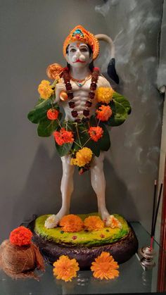 a statue of a man with flowers in his hands